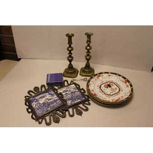 537 - 2 x Brass knocked candlesticks, Saltsberg tiles in a wrought iron case and a set of four iron stone ... 