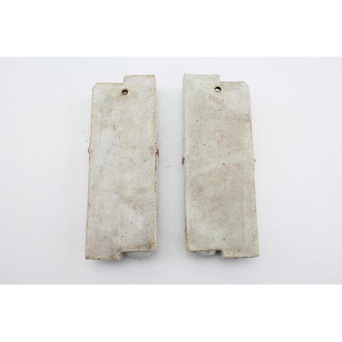 179 - A Pair of Chinese wall pockets designed as scroll holders in pale celadon floral decorated and bow t... 