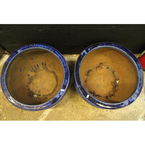 550 - Two Large blue glazed terracotta garden pots. Measuring: 51 cms x 32 cms.