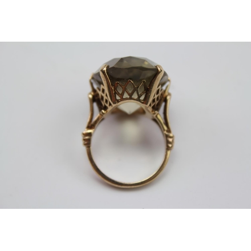 78 - A 9 carat Gold Ring set with a large Citrine.