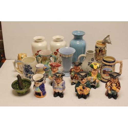 474 - A Collection of China Ware to include Poole Pottery, Floral vases, a collection of Toby jugs and oth... 