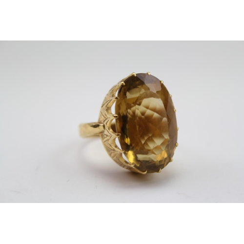 91 - A Ladies Single Stone Citrine Ring mounted in a yellow metal fitting.