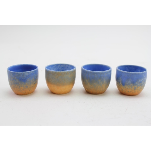 486 - A Ruskin of West Smethwick Blue and Orange Glazed 4 piece Egg Cup set with matching dish.