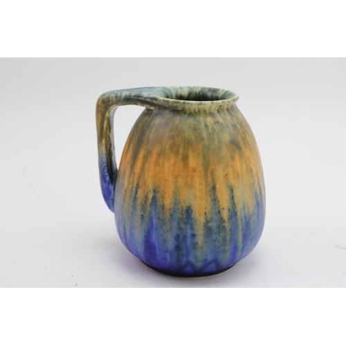 488 - A Ruskin of West Smethwick orange and blue jug, marked Ruskin 1925?. 13cm