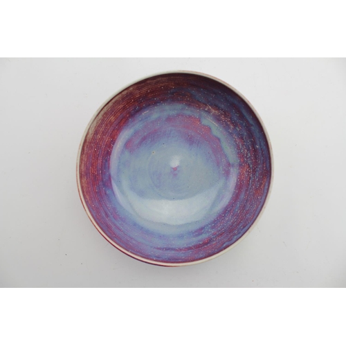 492 - A Ruskin of West Smethwick Sang de Boeuf bowl, marked Ruskin 1925. Measuring: 22cm.