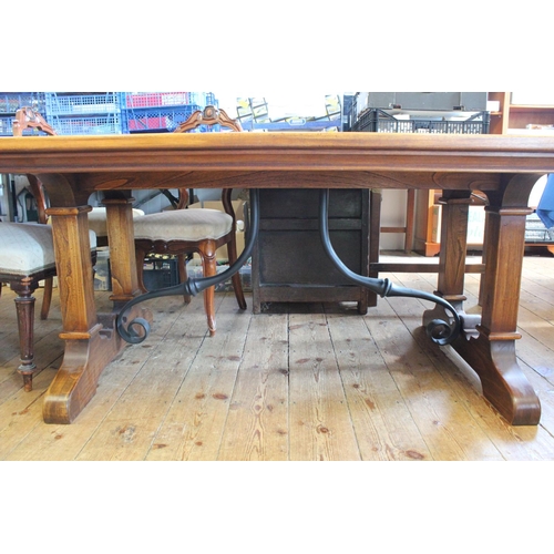 362 - A Large Oak Swiss Design Refectory table resting on shaped legs with iron cross stretcher. Measuring... 