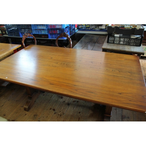 362 - A Large Oak Swiss Design Refectory table resting on shaped legs with iron cross stretcher. Measuring... 