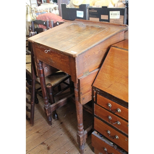 375 - A Early Eton standing pitch pine school desk with side shelf. Measuring: 60 cms wide x 55 cms deep x... 