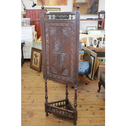 384 - A Victorian Oak Carved Fronted Corner Cupboard with Bobbin Decoration resting on shaped legs. Measur... 