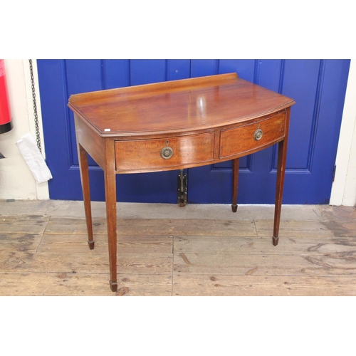 391 - A Georgian designed Beau Fronted Mahogany Side Table fitted with Two Drawers resting on square taper... 