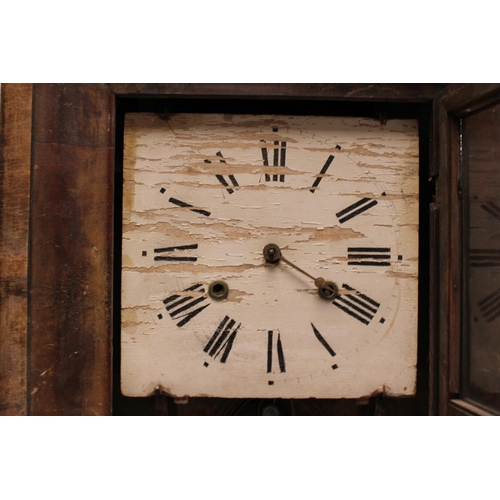 134 - An American Walnut Cased Wall Clock by 