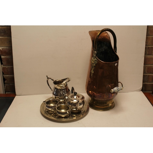 64 - A Copper Coal Scuttle along with a Silver Plated Tea Set on a Tray.