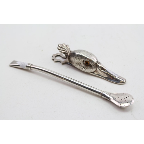 66 - A Silver Plated Ducks Head Paper Clip and a Mate Pot Spoon.