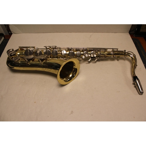 590 - A Corton Brass made Saxophone with mouth piece.