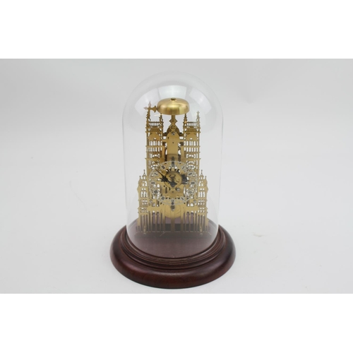 140 - A 20th Century Anniversary Clock on a wooden stand with a glass dome.