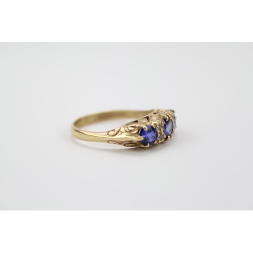 154 - A 9 carat Gold Ring set with three Sapphire coloured stones. Weighing: 3.7 grams.