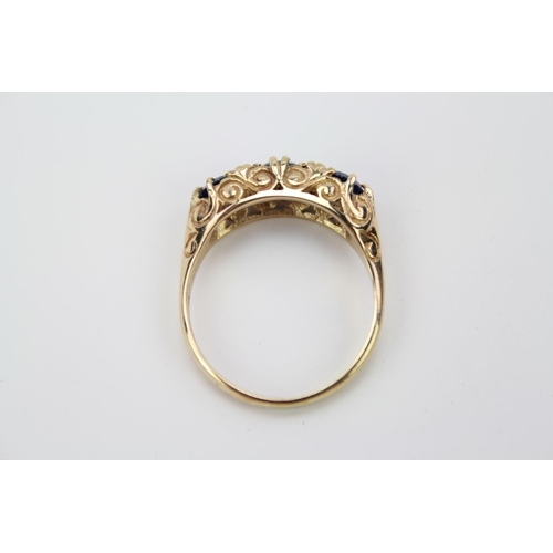 154 - A 9 carat Gold Ring set with three Sapphire coloured stones. Weighing: 3.7 grams.