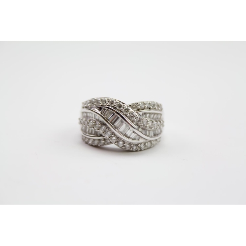 215 - A ladies 18 carat white Gold diamond ring, mounted with baguette & round diamonds. Size N. Weight ap... 