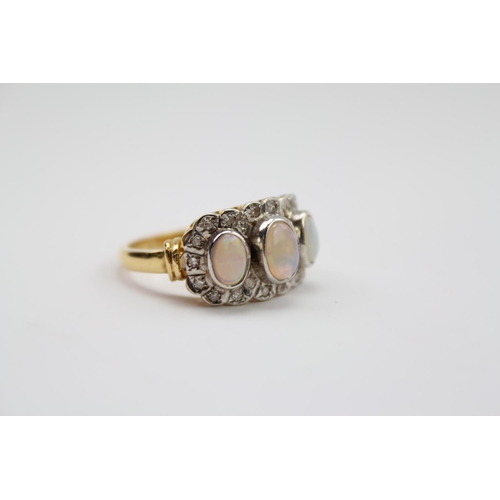 265 - A ladies diamond and 3 stone opal ring, in 18 carat gold. 22 diamonds in total. Size O. Weight appro... 