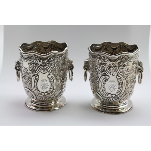 17 - A pair of silver miniature lion handled wine coolers with embossed decoration, Gold smiths and silve... 