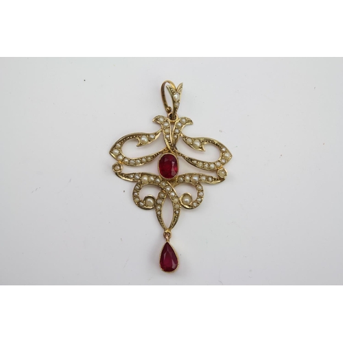 159 - A Victorian 9 carat Gold ruby and seed pearl pendant. Weight approximately 3.8g. Size approximately ... 