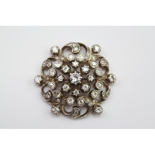 220 - A Victorian 9ct Gold, Silver, diamond mounted floral spray brooch, mounted with approximately 52 dia... 