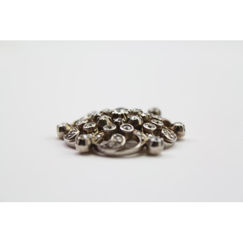 220 - A Victorian 9ct Gold, Silver, diamond mounted floral spray brooch, mounted with approximately 52 dia... 