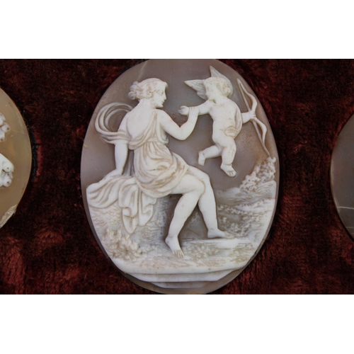 282 - A Georgian Frame containing a collection of Classical Cameo's including to Three Graces, Bacchus, Di... 