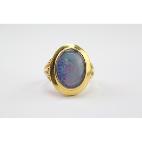 205 - A Ladies 18ct Gold cloudy Opal Set Ring. Weighing approximately 9.4 Grams. Size approximately R.