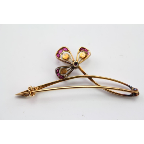 249 - An 18ct Gold Platinum Faced Art Nouveau Whiplash Floral Brooch, with Diamond and ruby Highlights, mo... 