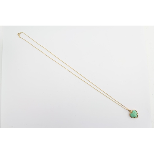 225 - A green jade hard stone necklace, hung from a 9ct Gold chain. Weight approximately 5.4g. Length appr... 