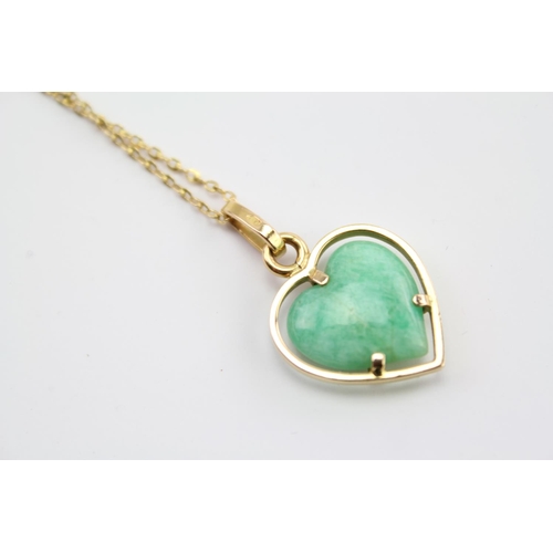 225 - A green jade hard stone necklace, hung from a 9ct Gold chain. Weight approximately 5.4g. Length appr... 