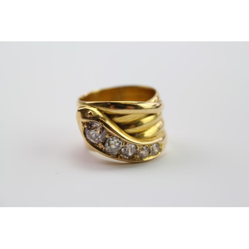 210 - A 18ct yellow Gold snake ring, the head mounted with 5 round and cushion shaped old cut diamonds, gr... 