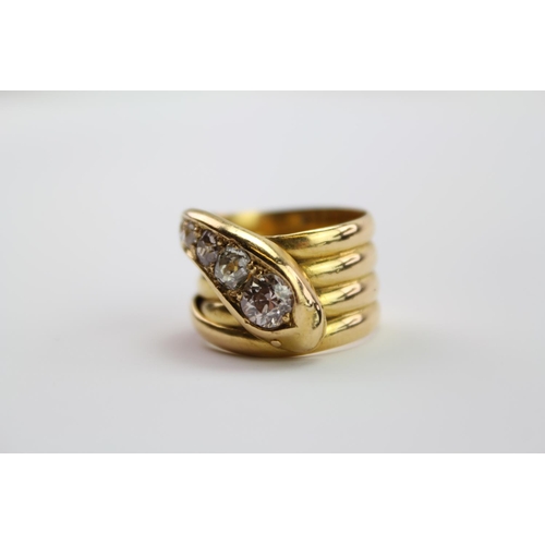 210 - A 18ct yellow Gold snake ring, the head mounted with 5 round and cushion shaped old cut diamonds, gr... 