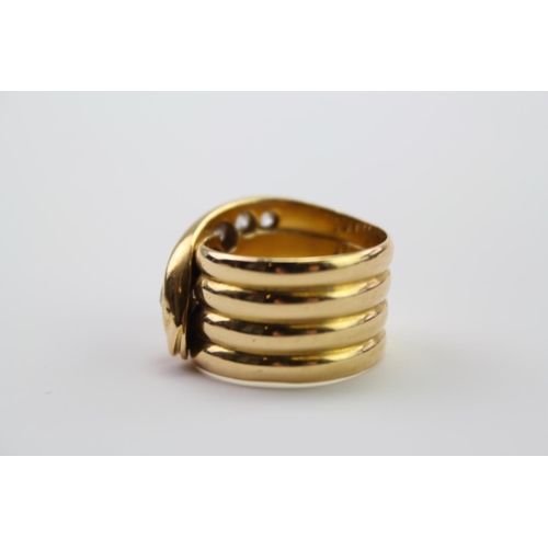 210 - A 18ct yellow Gold snake ring, the head mounted with 5 round and cushion shaped old cut diamonds, gr... 