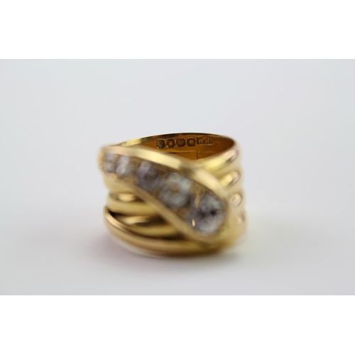 210 - A 18ct yellow Gold snake ring, the head mounted with 5 round and cushion shaped old cut diamonds, gr... 