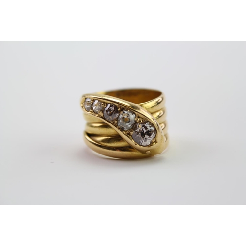 210 - A 18ct yellow Gold snake ring, the head mounted with 5 round and cushion shaped old cut diamonds, gr... 