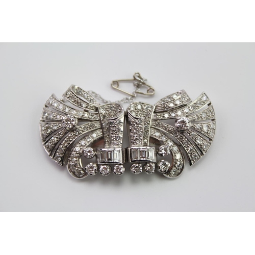 231 - A Ladies Platinum diamond set brooch, mounted with two fold over prong clips, set with 130 Diamonds ... 