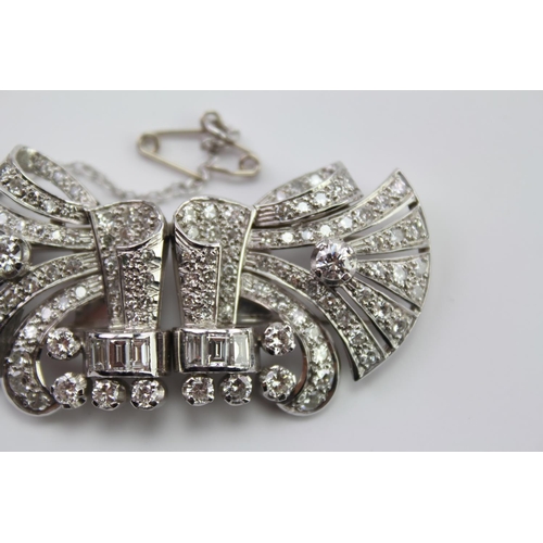 231 - A Ladies Platinum diamond set brooch, mounted with two fold over prong clips, set with 130 Diamonds ... 