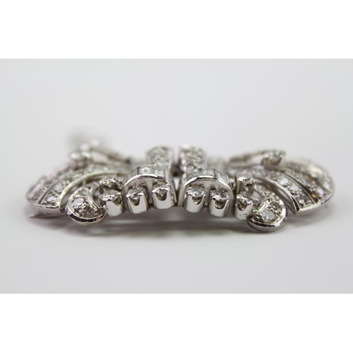 231 - A Ladies Platinum diamond set brooch, mounted with two fold over prong clips, set with 130 Diamonds ... 