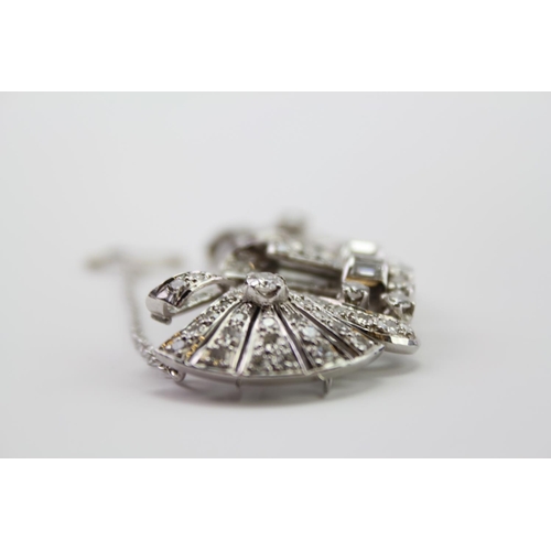 231 - A Ladies Platinum diamond set brooch, mounted with two fold over prong clips, set with 130 Diamonds ... 