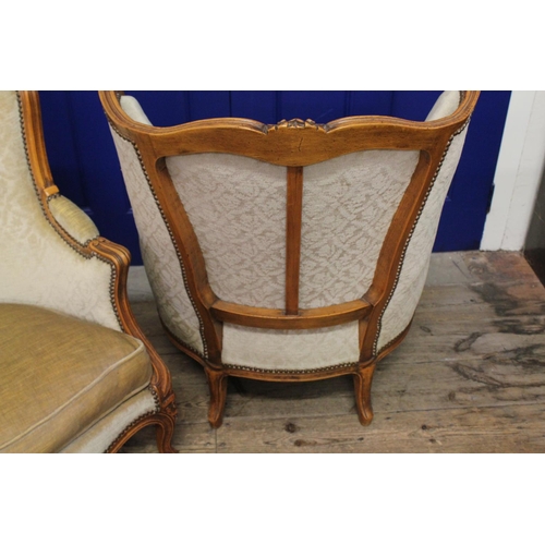 396 - A Pair of French Walnut Designed Fauteuils upholstered in cream.