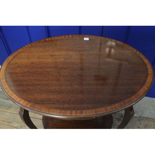 415 - An Edwardian Satinwood inlaid Oval Tea Table resting on shaped legs. Measuring: 63 cms wide x 41 cms... 