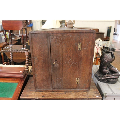 421 - An Antique Oak Single Doored Cabinet with Heart Shaped Decoration. Measuring: 60 cms wide x 47 cms d... 