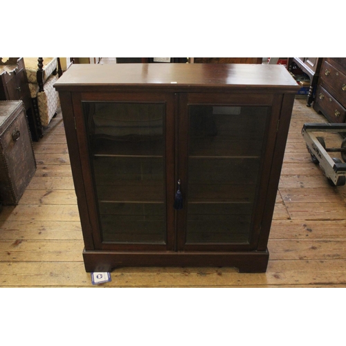 423 - A Stained as beech 2 Door Victorian Book Case fitted with two shelves. Measuring: 91 cms across x 25... 