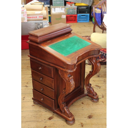 425 - A Reproduction Mahogany Davenport with Lift-Top & Side Drawers. Measuring: 55 cms across x 54 cms de... 