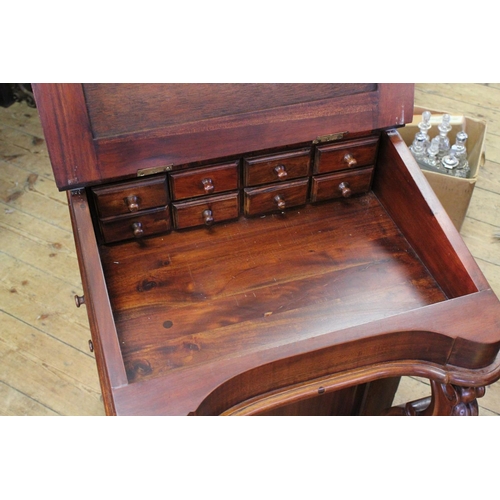 425 - A Reproduction Mahogany Davenport with Lift-Top & Side Drawers. Measuring: 55 cms across x 54 cms de... 