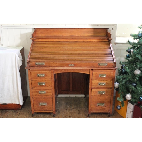 427 - An American Design Tambour Topped Roll over desk fitted with pedestal sides and glass inkwells. Meas... 