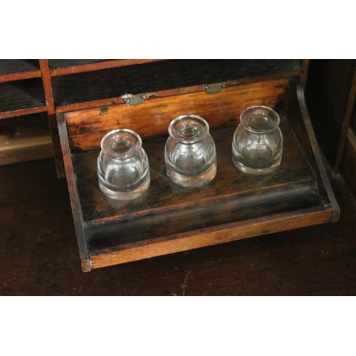 427 - An American Design Tambour Topped Roll over desk fitted with pedestal sides and glass inkwells. Meas... 