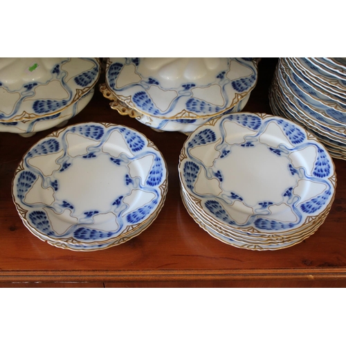 481 - An Art Nouveau Whiplash flow blue dinner set consisting of a large tureen, two smaller tureens, 6 th... 